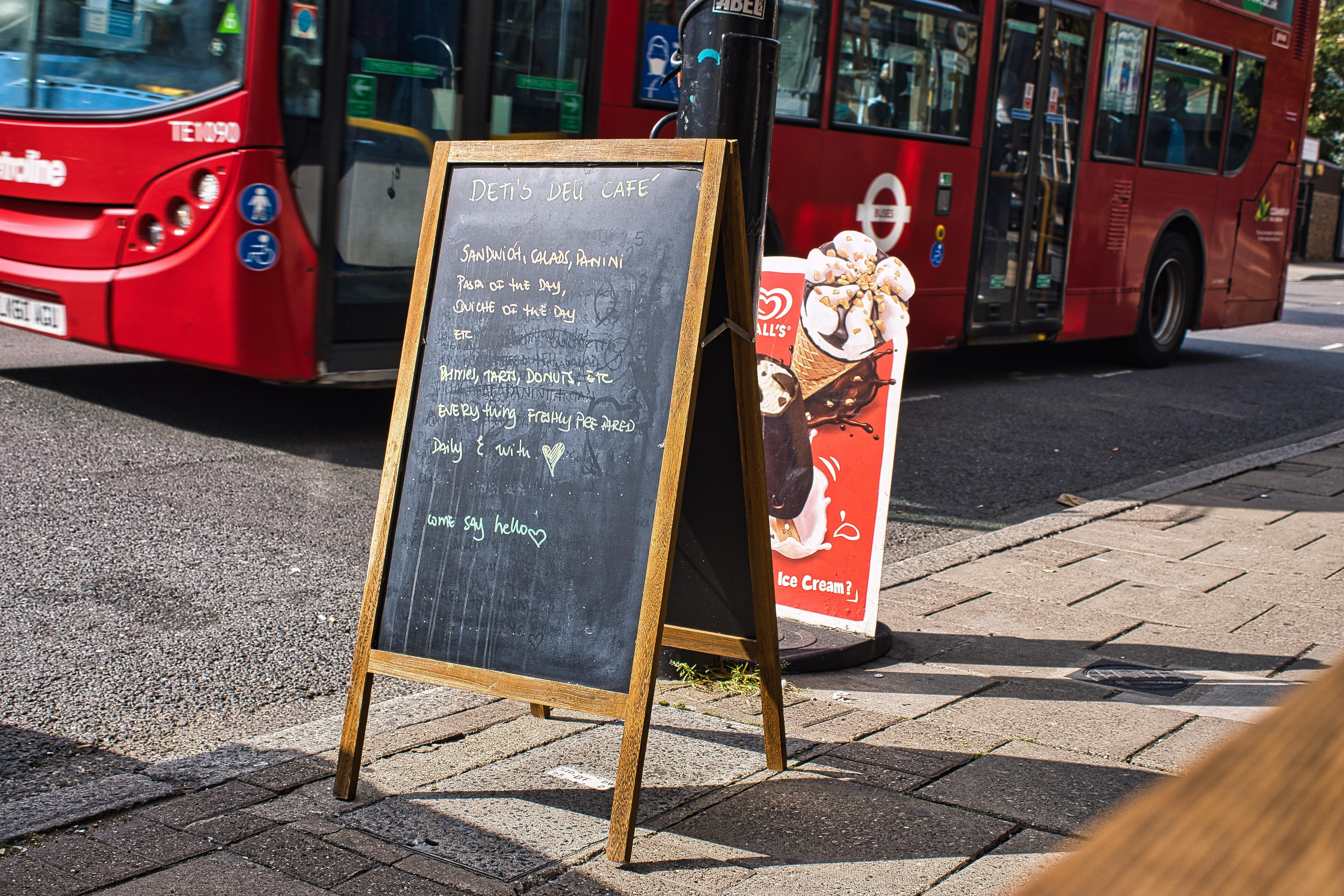 A bus going past the café.